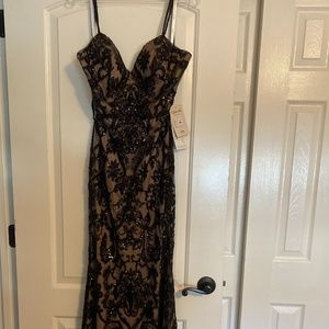 New with Tags. Never worn or altered. Black Sequin gown